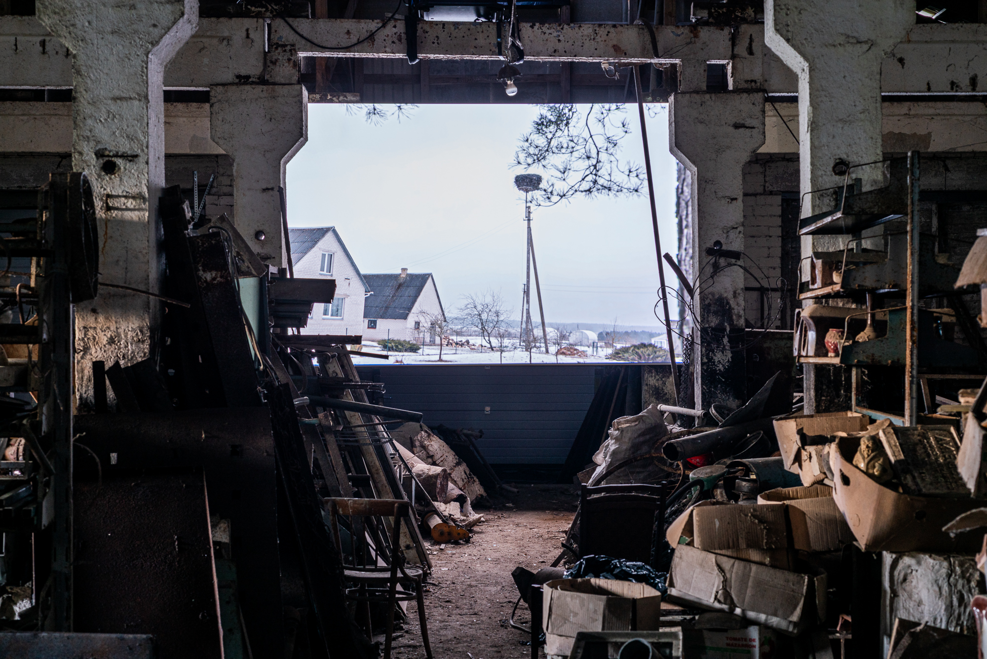 Ferma installation — view through the barn towards the winter landscape